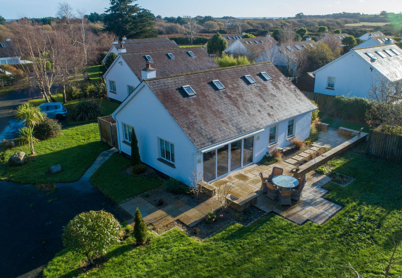 Brittas Bay Holiday Park No 7.  Aerial view, large home, patio, garden. 