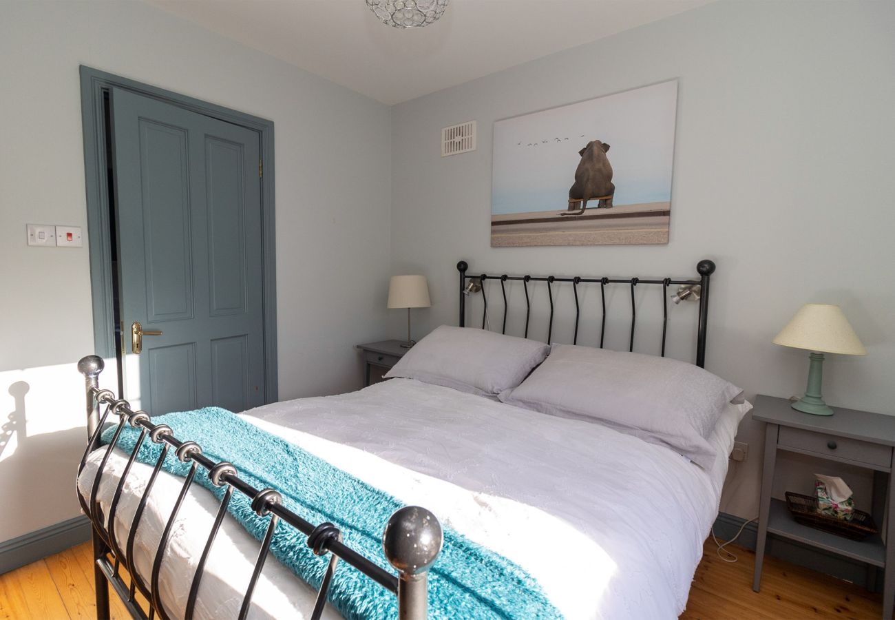 Brittas Bay Holiday Park No 7.  Double Room. Cottage style, wrought iron bed, wooden floors. 