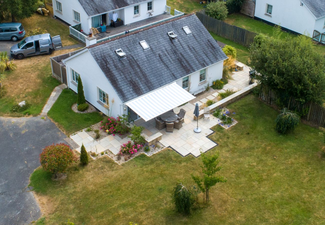 Brittas Bay Holiday Park No. 7.  Aerial view of private back garden with patio, garden furniture, awning and mature trees.