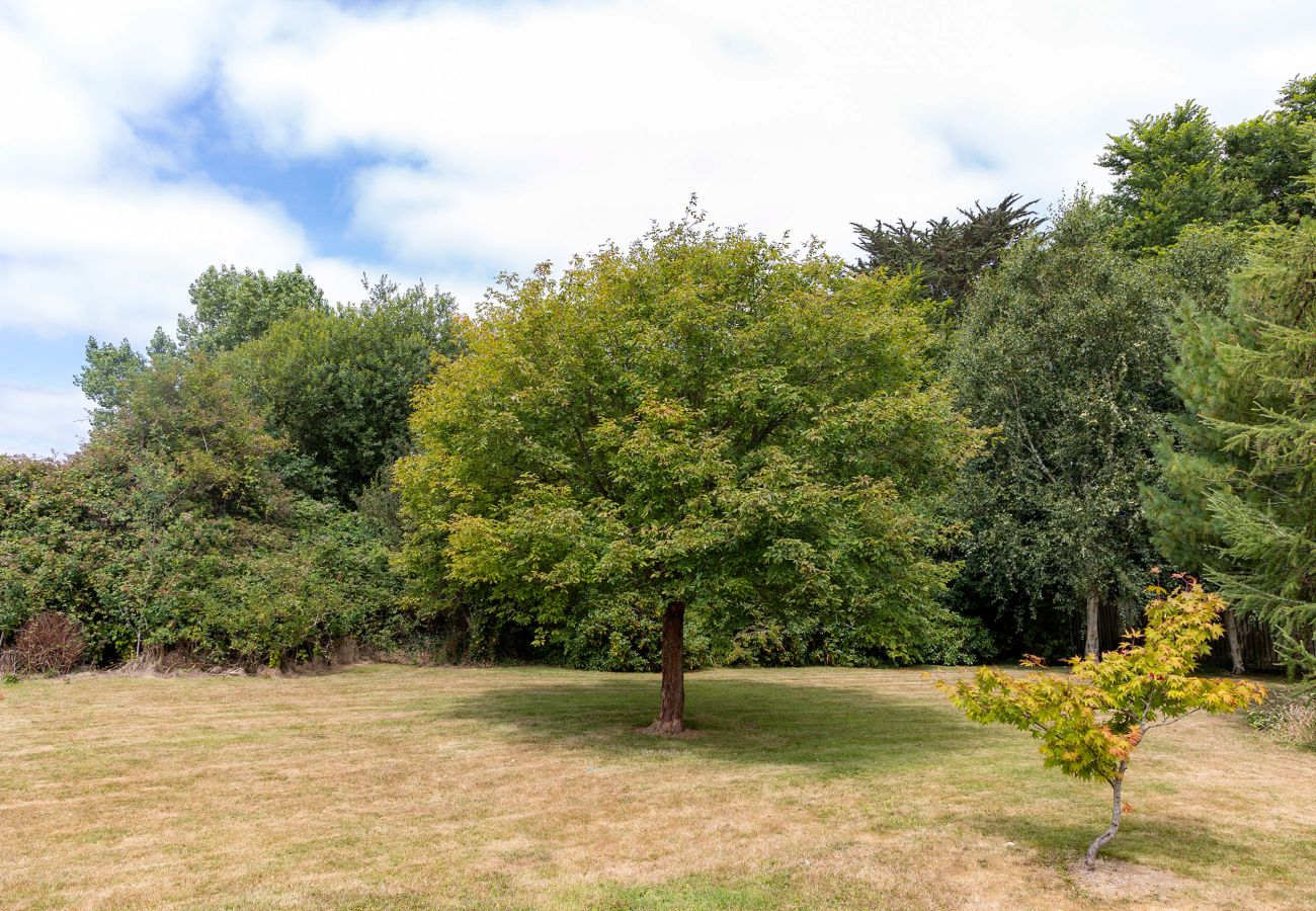Brittas Bay Holiday Park No. 7.  Private garden with mature trees. 