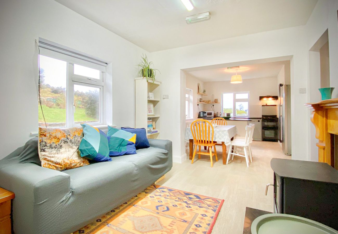 Renvyle Holiday Home Connemara. Open plan kitchen dining, wood burning stove comfortable layout. 