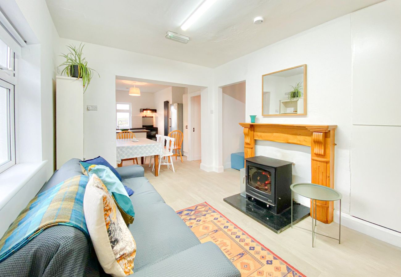 Renvyle Holiday Home Connemara. Kitchen, dining open plan. Wood fire burning stove. 