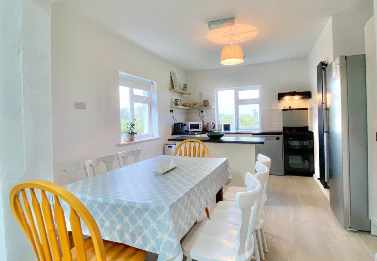 Renvyle Holiday Home Connemara. Bright modern Kitchen. Dining table for group. 