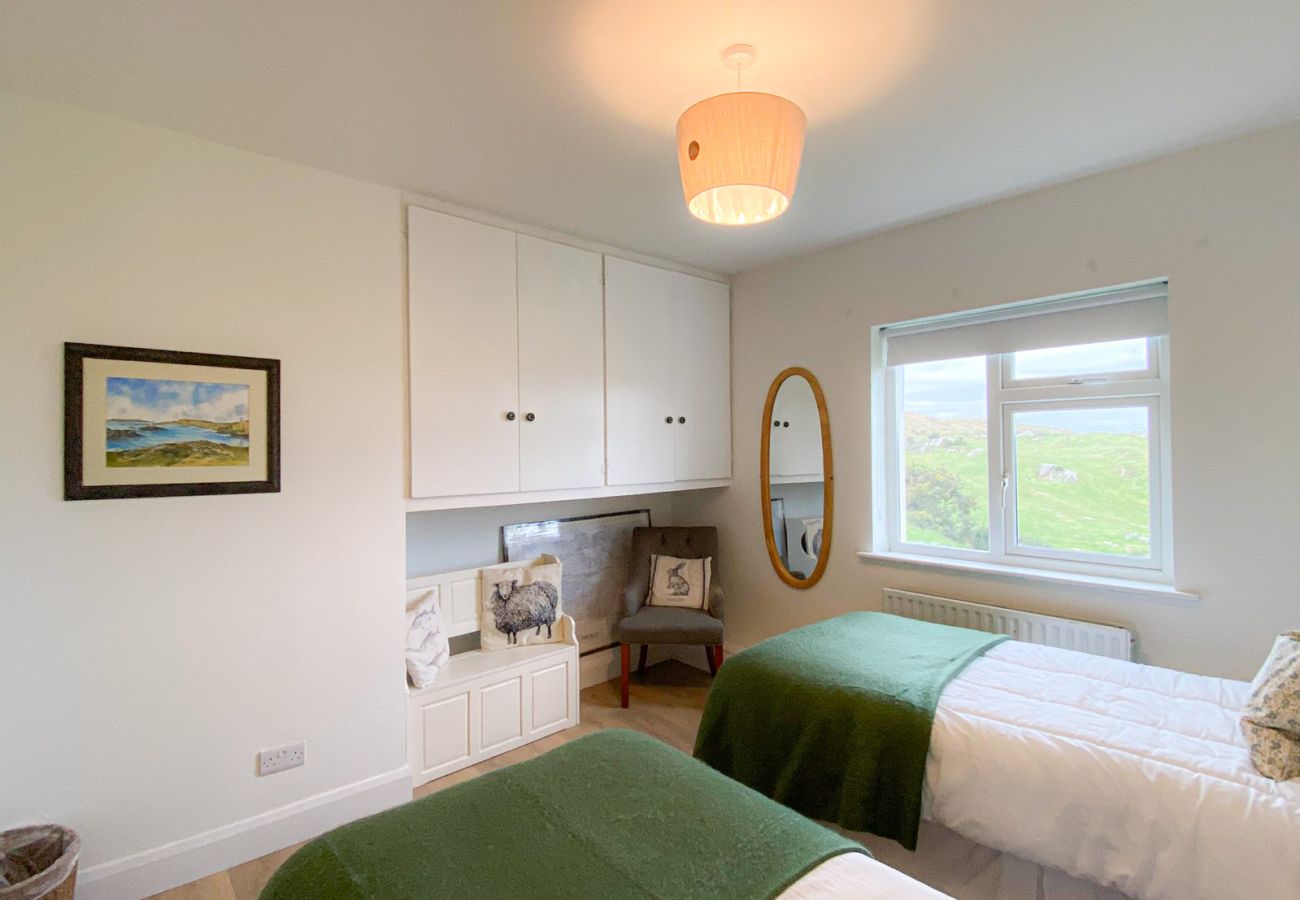 Renvyle Holiday Home Connemara.  Twin room with 2 single beds., views and storage. 
