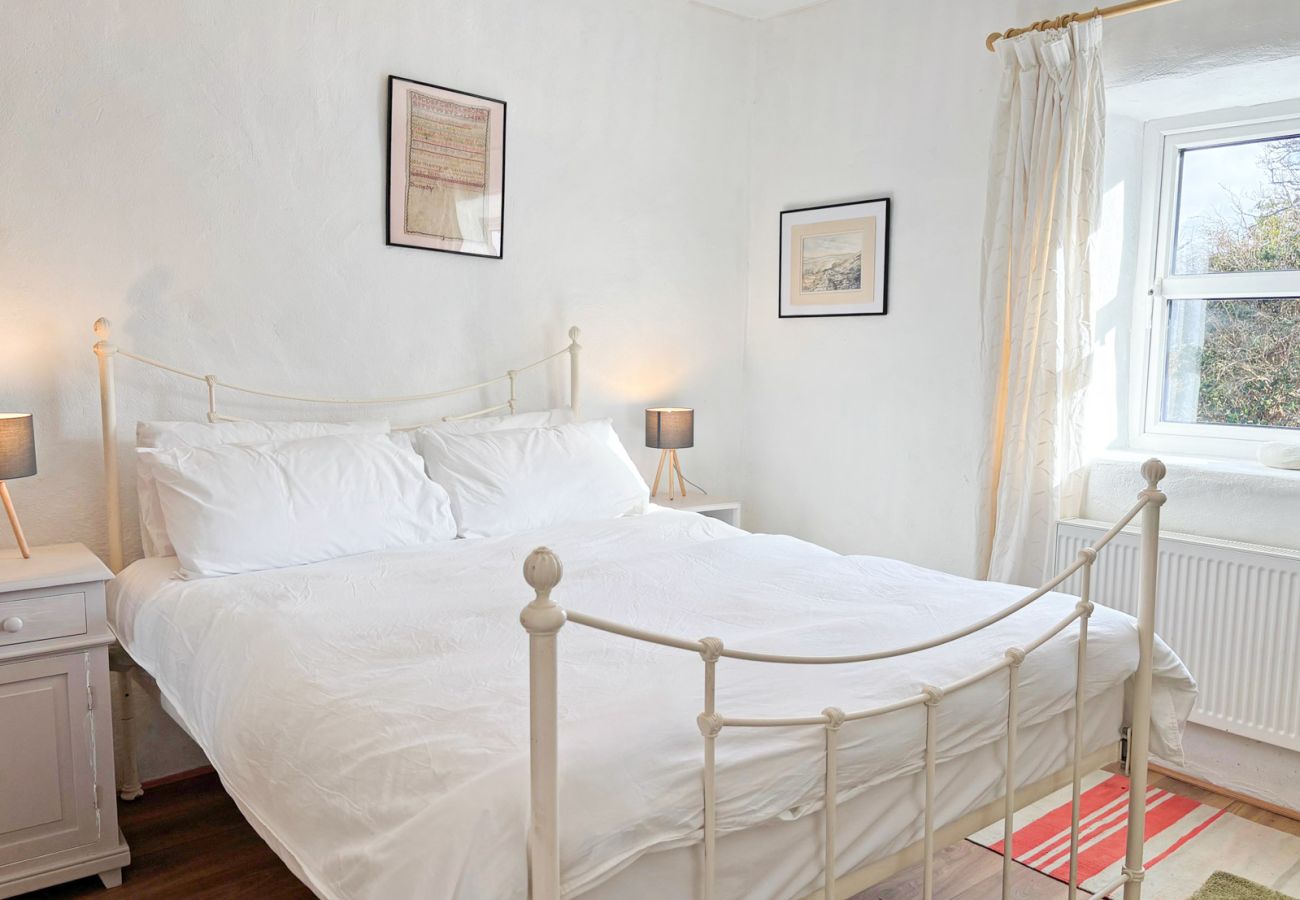 Moyard Stone Cottage, Connemara.  Bedroom, white, clean, bright cottage style. 