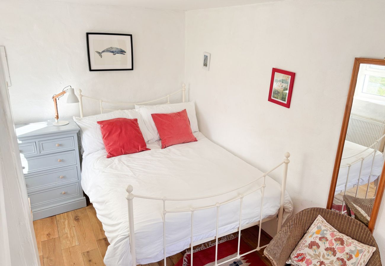 Moyard Stone Cottage, Connemara.  Double bedroom. White cottage style furniture. Tasteful design