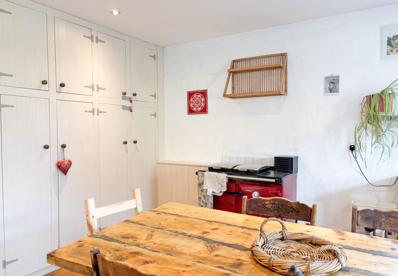Moyard Stone Cottage, Connemara.  Country cottage style kitchen Rayburn stove, wooden furniture.