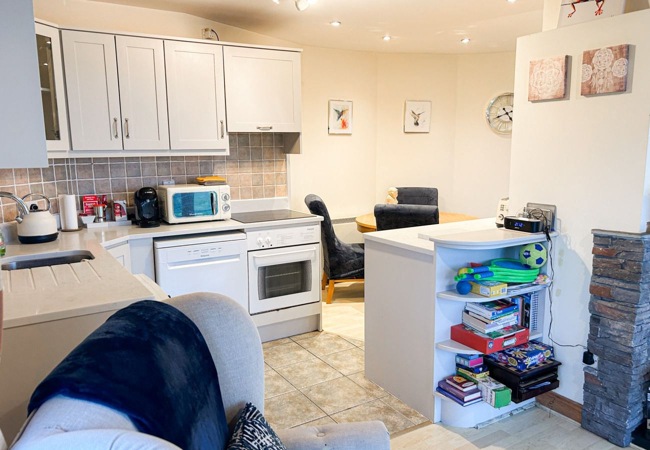 Glasson Mews Holiday Home No. 2. Compact kitchen open plan to living room 