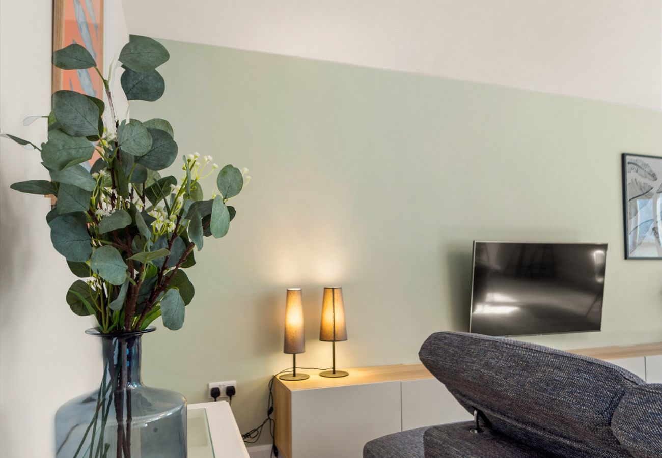 The Town Place Apartment Clifden. Living room, soft furnishing and soft lighting. Modern design. 