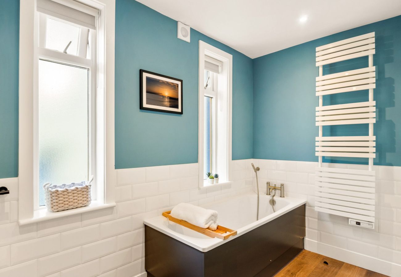 Clifden Boutique Apartment. Bathroom bath wall heater.