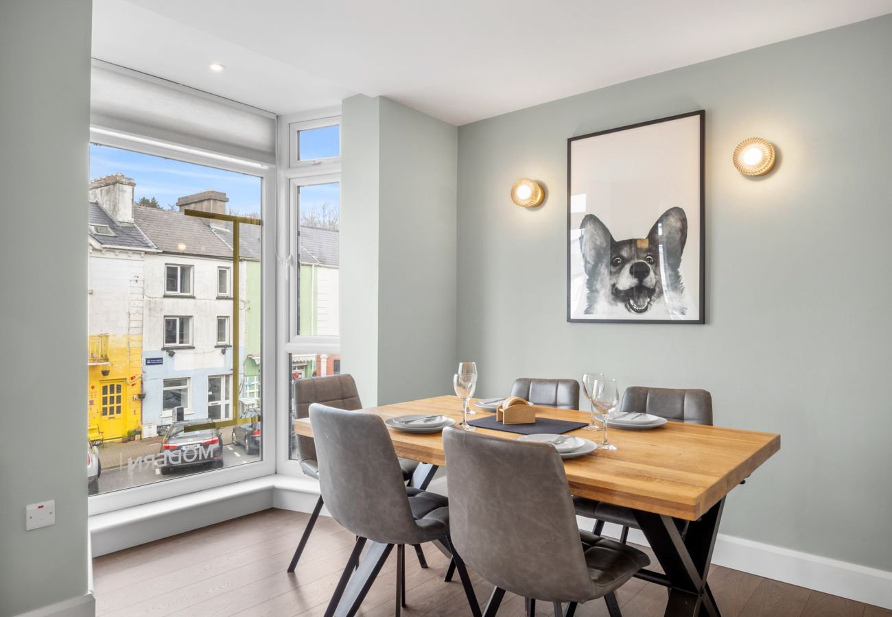 Clifden Boutique Apartment. Dining table seats four,view to street
