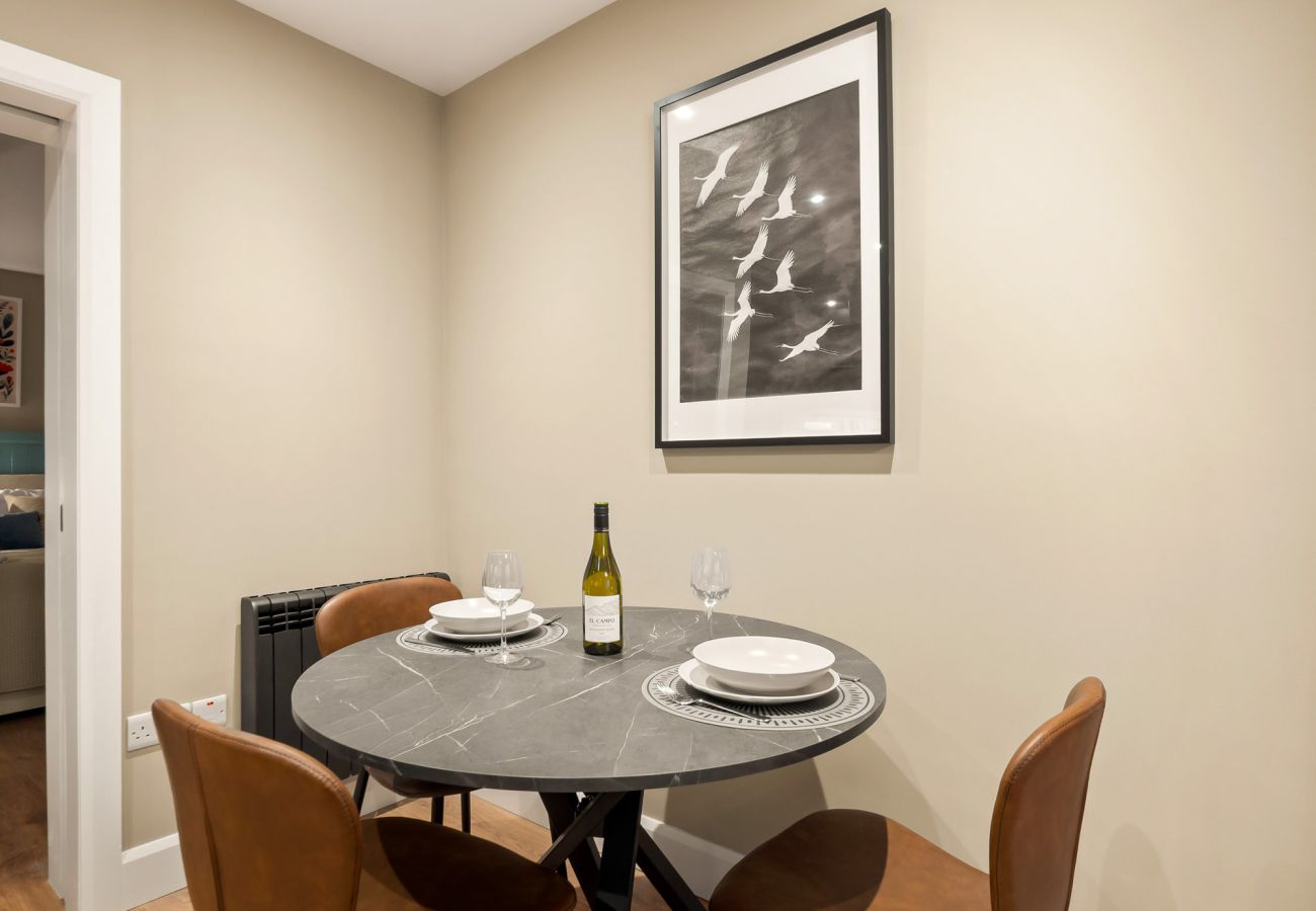 Main Street Hideaway Clifden. Dining table for three open plan modern apartment