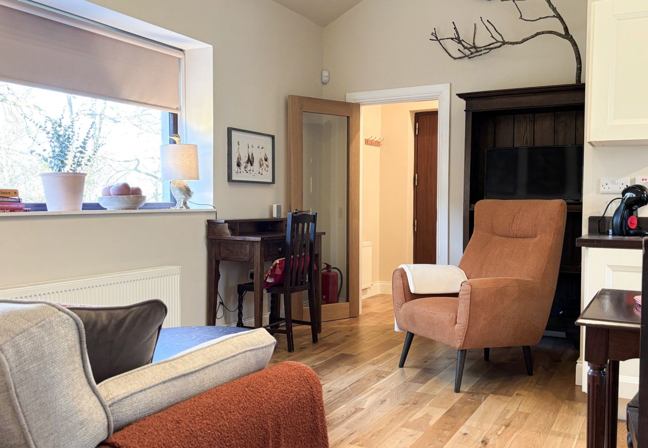 Kylemore Woodland Holiday Apartment. Open plan living room stylish furniture. 