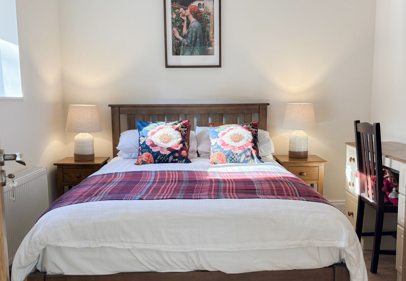 Kylemore Woodland Holiday Apartment. Double Bed side locker and desk