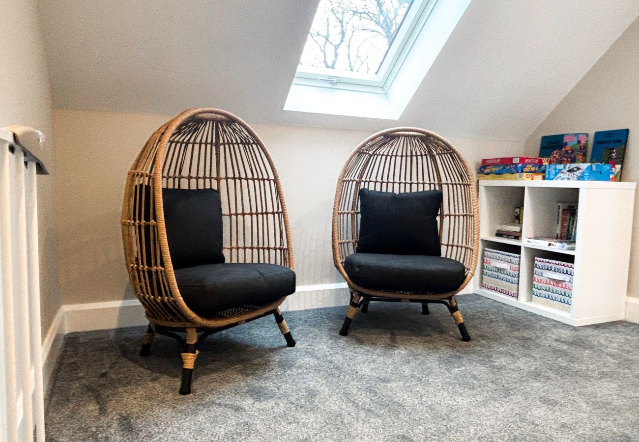 Clifden Holiday Home. Double seating and reading area with plush carpet. 