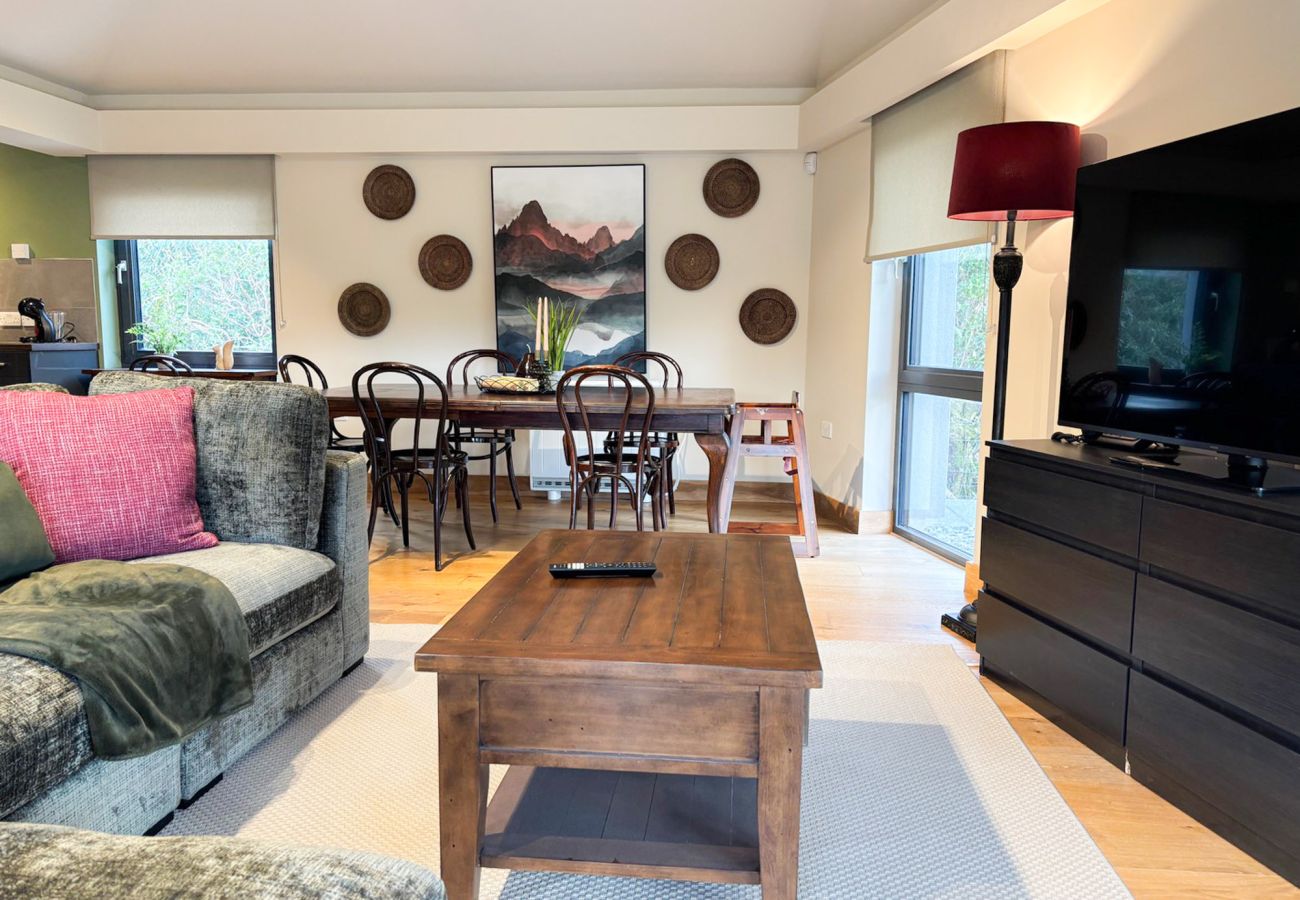 Kylemore Gate Lodge. Modern family holiday home, open plan dining couch and large TV