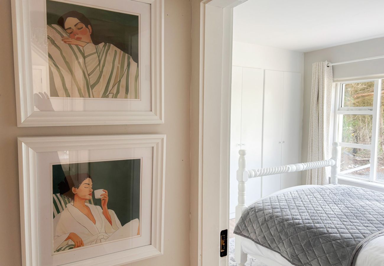 Luxurious Clifden Cottage. Luxury bedroom with tasteful art. 