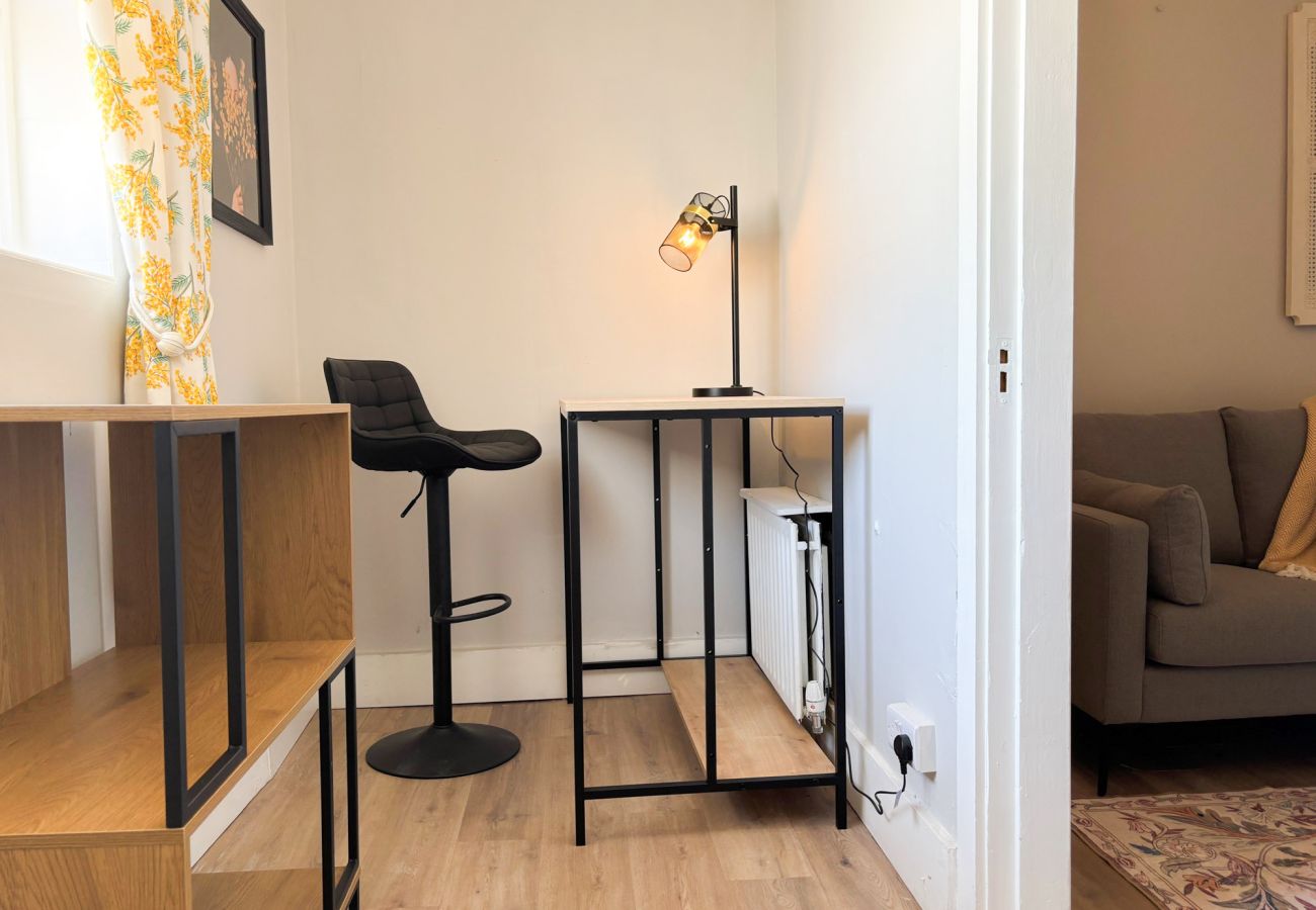 Luxurious Clifden Cottage. Quiet area with desk and lamp and storage. 