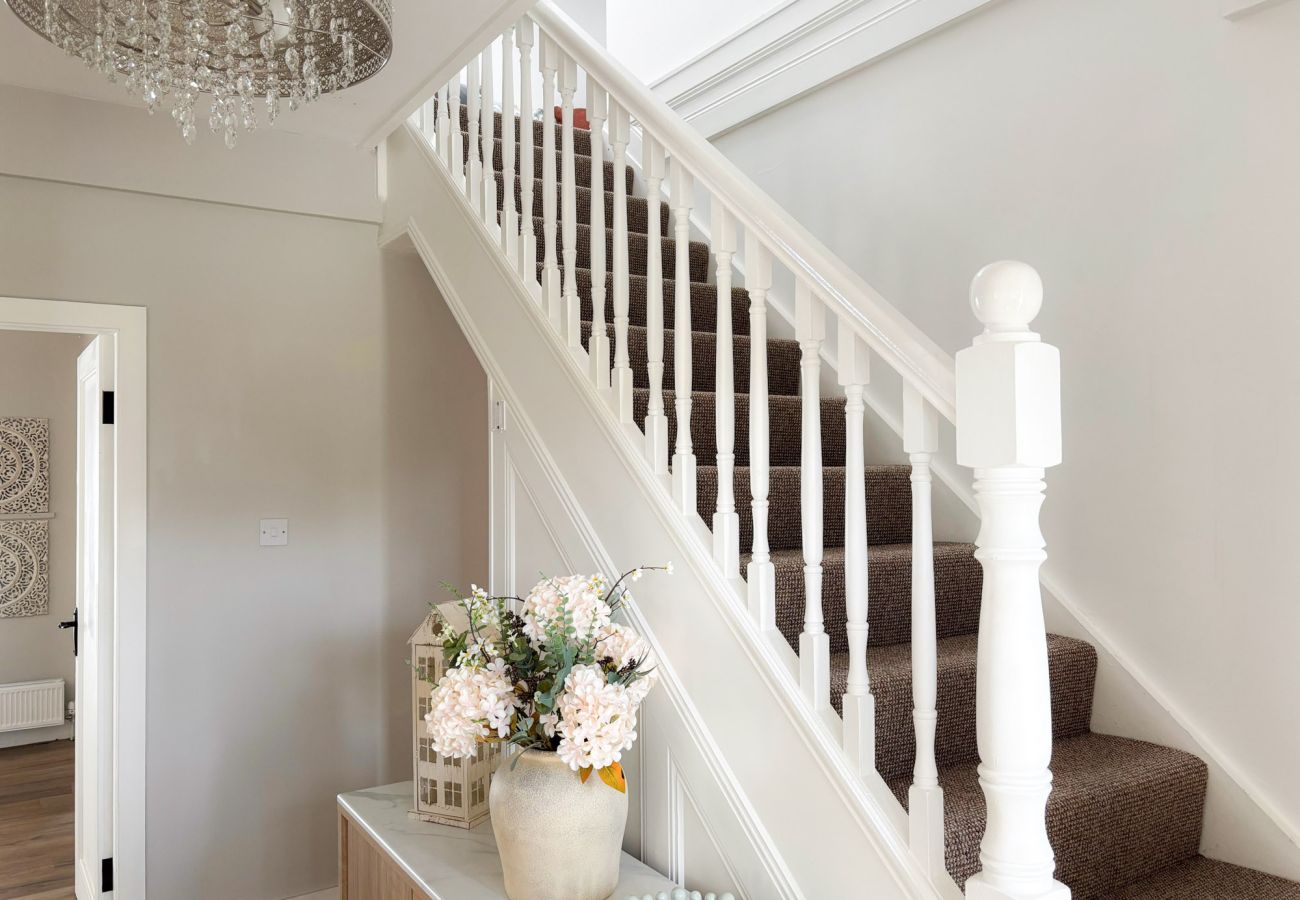 Luxurious Clifden Cottage. open staircase to upper floor.