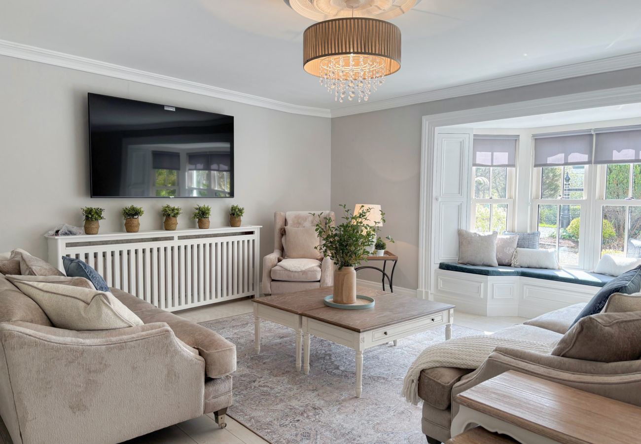 Luxurious Clifden Holiday Home.  Spacious Living room, comfortable furniture large bay window. 