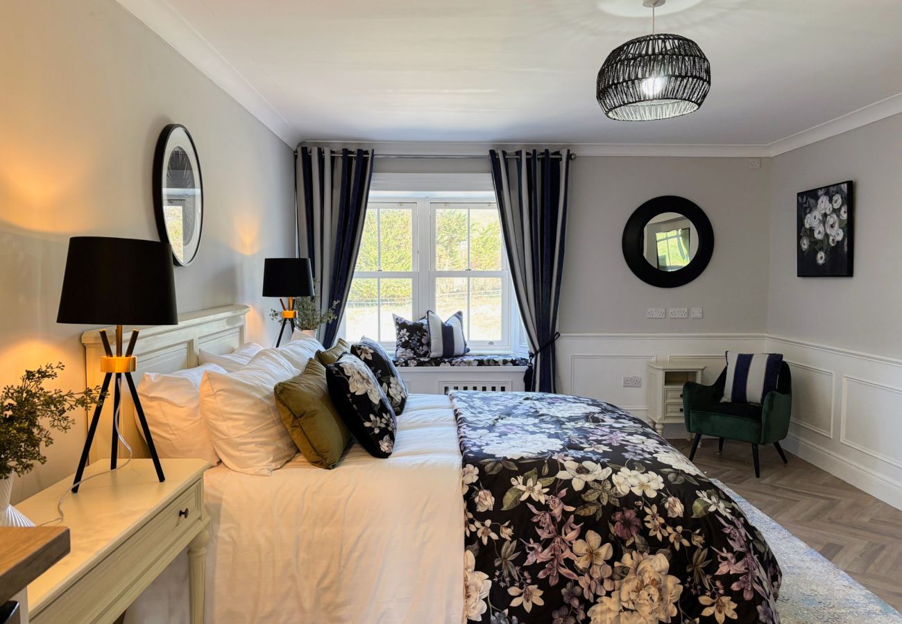 Luxurious Clifden Holiday Home. Comfortable double bed with tasteful decore and large window with view. 