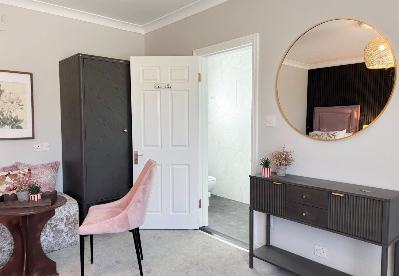 Luxurious Clifden Holiday Home. Table and soft chair, mirror