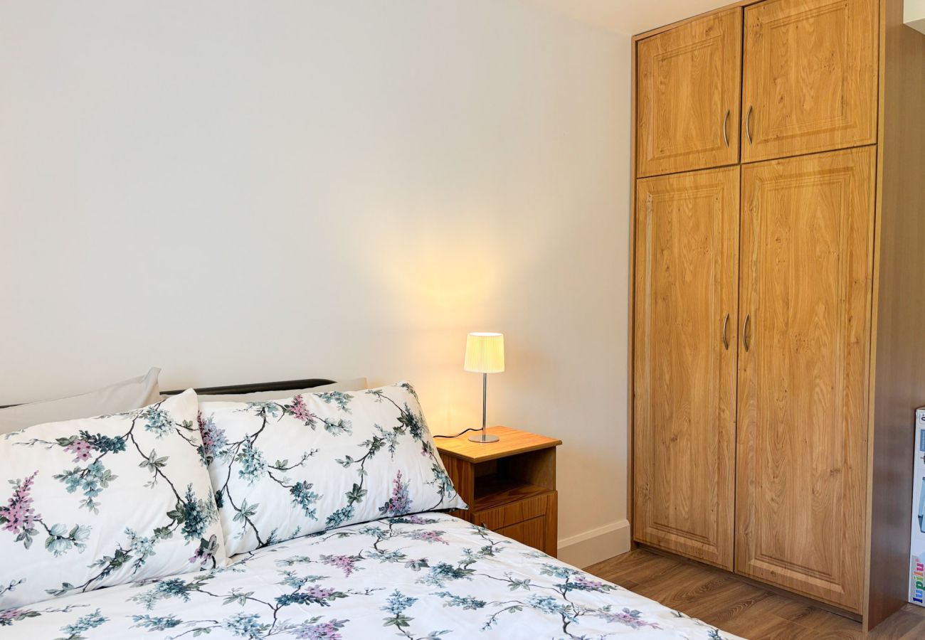 Bluebell Cottage Roundstone. Double bed with large wardrobe. 