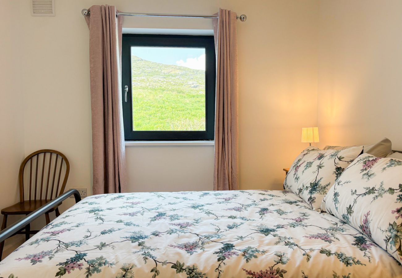 Bluebell Cottage Roundstone. Double bed with view 