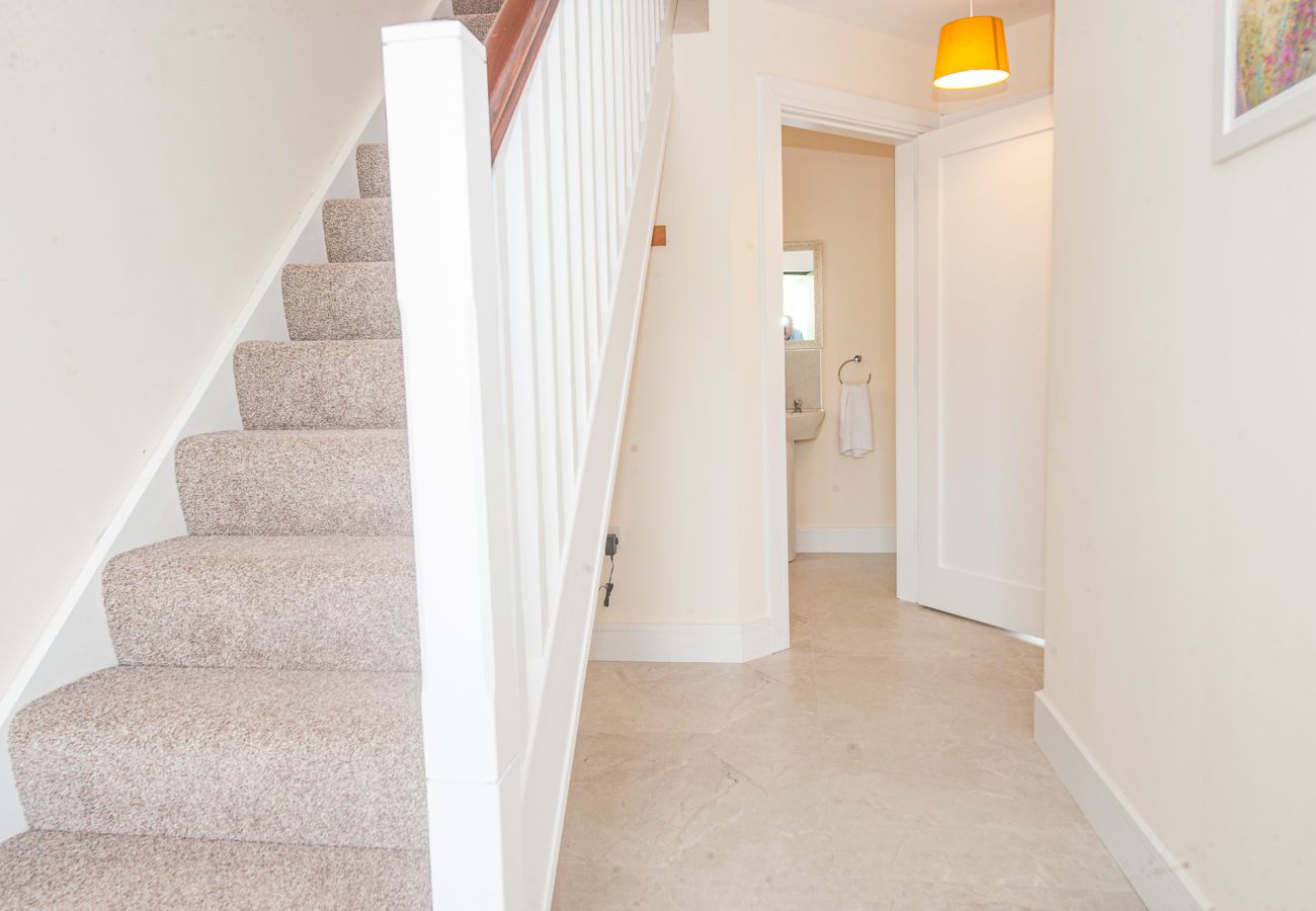 Dunmore East Sunrise Meadows Holiday Home. Bright hallway with staircase. Downstairs WC