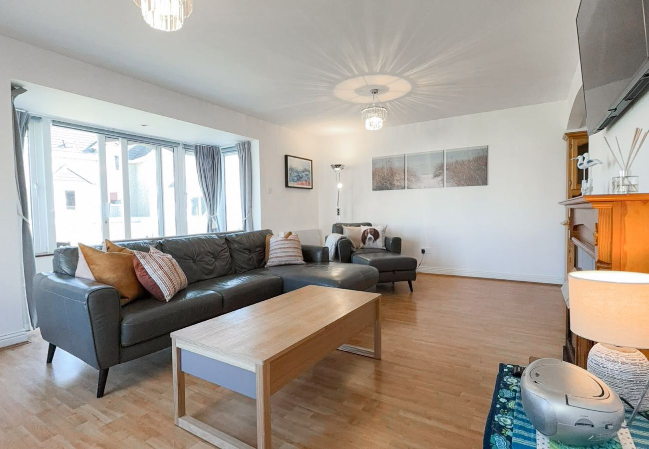 MooreBayHolidayVillage8D. Large bright contemporary living room with wooden floors. 